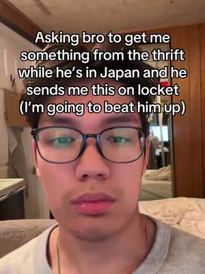 A selfie-style video cover featuring a person in the foreground, centered in the frame with a neutral expression. The person is wearing glasses. Text overlay is positioned above the person's head.