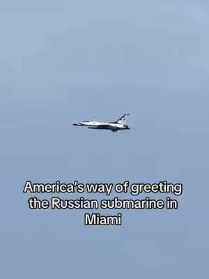 The cover image shows a jet airplane flying in the sky. Below it, the text "America's way of greeting the Russian submarine in Miami" is displayed.