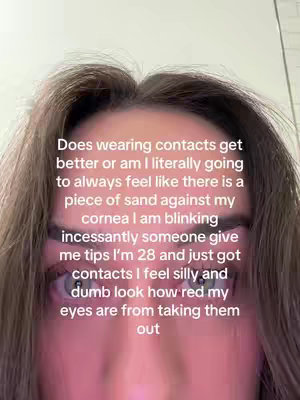 A close-up shot showcases a person's face, focusing on their eyes. The individual's eyebrows, forehead, and hair are partially visible, with the central focus on the eyes, which appear red. The text overlay suggests the person is discussing the challenges of wearing contact lenses.