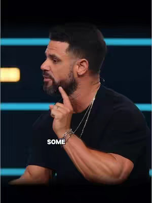 A man with a beard is shown in profile, looking slightly off-camera. He's wearing a black t-shirt and delicate silver necklaces, with a silver bracelet on his wrist. His index finger is touching his chin, and text that says SOME is overlaid on the cover image.