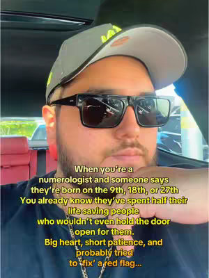 A man wearing sunglasses and a cap is inside a car. Text in yellow overlay with a black background is added to the image.