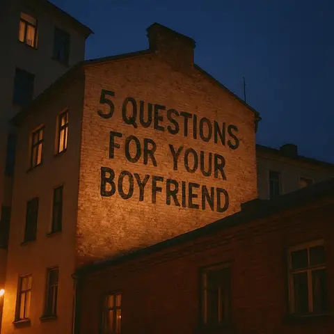 An outdoor nighttime shot featuring a two-story brick building with '5 QUESTIONS FOR YOUR BOYFRIEND' stenciled onto its side. The building is lit with a warm glow against a dark blue sky.