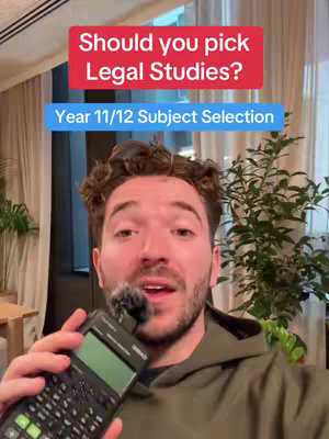 A man with a beard wearing a green hoodie holds a calculator in front of him. Overlay text indicates the video's topic.