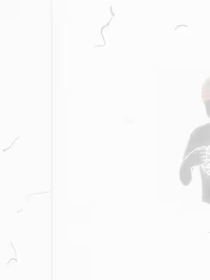 The image is washed out, with a bright, nearly white background. Faint, abstract shapes and lines float across a portion on the left side of the frame. On the right, a figure, likely a person, is mostly silhouetted. They appear to be wearing a dark shirt with a skeletal design and a red headband.