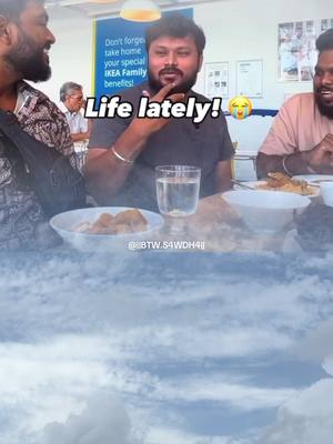 The cover image features a group of three men seated at a table, appearing to be at a restaurant or dining area. The background shows a bright, open space, possibly an IKEA, adding context to the scene. The primary visual elements include plates of food, glasses of water, and the men, who are engaged in what seems to be a casual conversation or moment of laughter. Text overlayed on the image includes the phrase 'Life lately!', along with an emoji conveying a mix of emotion, possibly amusement.