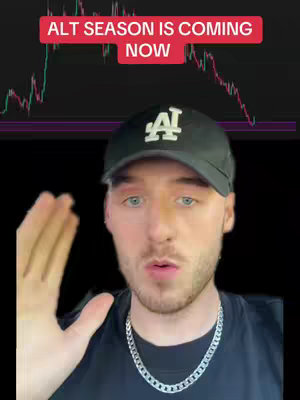A man with light skin and blue eyes is centered in the frame, framed from the chest up. He wears a black LA Dodgers baseball cap, a silver chain, and a black t-shirt. Behind him is a stock market graph that moves from green to downward red.