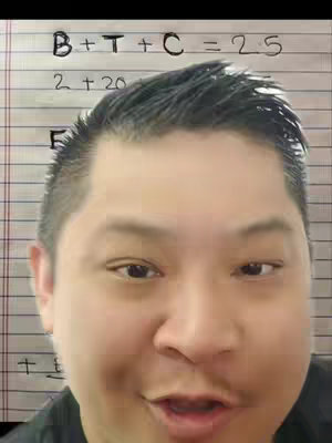 A medium shot features a man with short, dark hair centered in the frame, set against a background of lined notebook paper with handwritten text and calculations. The man has an open mouth, appearing to be speaking, and his eyes are focused. The background paper has equations written on it with ink.