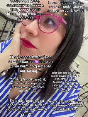 A woman with dark hair and glasses looks up slightly, resting her hand on her cheek. Text in white boxes covers parts of the image