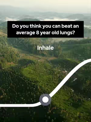 Aerial view of a green, hilly landscape with text overlays. The top of the image has a black rectangular box containing white text. Below the black box is the word "Inhale" in white. A white line moves across the image, connecting to a gray circle.