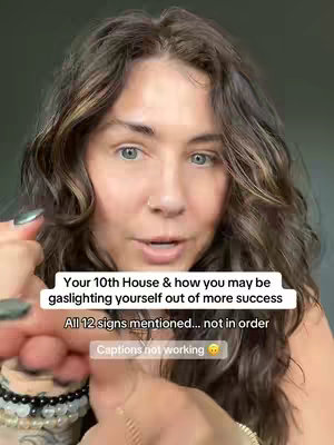 The cover image is a close-up shot of a woman with wavy brown hair and light skin. She has blue eyes and is looking directly at the camera with a serious expression. The background is a blurred, neutral color. Text overlays are present, including a hook about the 10th house in astrology and how someone might be gaslighting themselves out of success.