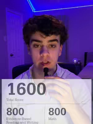 A young man looks directly at the camera, with a microphone in front of his mouth. Behind him is a blurred background with a blue-lit ceiling. A graphic of an SAT score is semi-transparently overlaid on the lower third of the image, displaying a total score of 1600, with 800 in Evidence-Based Reading and Writing and 800 in Math.