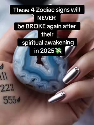 A close-up shot shows a hand holding a geode, with the background blurred. Text overlays appear in stacked black boxes, stating: \"These 4 Zodiac signs will NEVER be BROKE again after their spiritual awakening in 2025\". The hand has long, silver, metallic nail polish and a small tattoo is visible. The overall image suggests themes of spirituality and astrology.