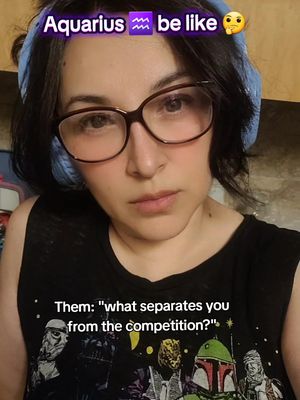 The cover image is a selfie of a person with short black hair, glasses, and a stern expression, framed from the shoulders up. An overlay at the top reads "Aquarius be like" with a zodiac symbol and an emoji. A second text overlay below reads "Them: 'what separates you from the competition?'".
