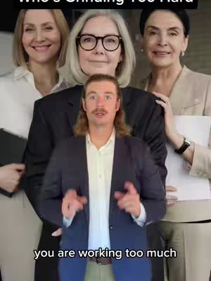 The cover image shows a man in a suit with three women standing behind him. The text overlay reads 'Who's Grinding Too Hard'. Below the man, there's another text overlay that says 'you are working too much'. The overall composition suggests a comparison or judgment, with the man seemingly being assessed by the women.