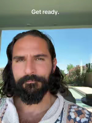 The cover image features a man in the foreground, with a beard and long hair, looking directly at the camera. The background shows a sunny outdoor view. The text 'Get ready.' is overlayed at the top.