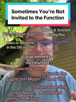 A selfie-style image featuring a young woman with glasses and brown hair, positioned against a blurry outdoor background. Overlayed text in a white box reads "Sometimes You're Not Invited to the Function." Below, various astrological terms are listed in different colors, including "Pisces Moon & Venus," "Taurus & Scorpio Rising/Asc", and "Mars or Neptune in the 5th or 11th."
