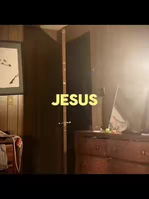 The cover image shows a room interior with a partially open door, a wooden dresser on the right, and a framed picture on the left. The text overlayed says, "JESUS" in a yellow color.