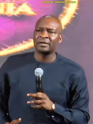 The cover image features Apostle Joshua Selman speaking into a microphone. He is dressed in a dark blue shirt. The background is a blurred mix of gold and purple hues.