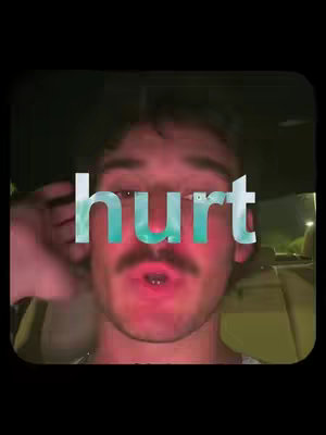 A close-up shot of a man's face. He is looking slightly upwards with a concerned expression, and the text "hurt" is superimposed over his face.