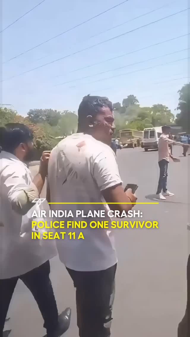 The image shows a street scene with a man with blood on his face being helped by two people. The overlay includes information about an air crash and finding a survivor.