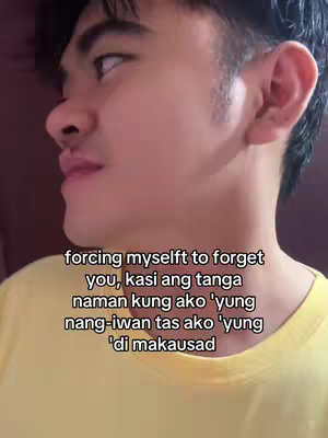 A selfie-style shot featuring a young man looking off to the side, the background slightly blurred. He's wearing a yellow shirt. Text overlayed on the image displays a message in Filipino.