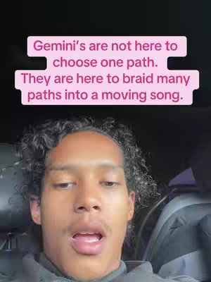 A selfie-style shot featuring a young man with dark, curly hair against a blurred background, seemingly inside a vehicle. Overlayed on the image is a pink text box containing text related to the Gemini zodiac sign.