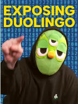 The cover image features a person wearing a green owl-like mask with large eyes and a hooded black sweatshirt. The background is a matrix of blue numbers. The person's hand is pointing towards the viewer. Text overlay indicates the video's focus is on Duolingo.
