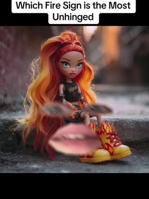 The image displays a doll in a fiery-themed aesthetic. The doll has orange and yellow hair styled in a high ponytail and is wearing a black top, a skirt with fire-like patterns, and yellow boots with flame accents. The background appears to be an out-of-focus urban setting with hints of buildings and ground. Overlayed on the image are blurred elements, including a pink lip image and unclear objects appearing to be positioned near the doll's body.
