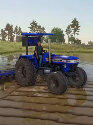 A rural scene showcasing a blue and white tractor in a field of water, with a man driving. The background features trees and a slightly overcast sky.