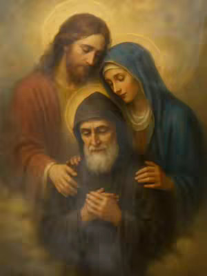 A religious image depicting Jesus Christ and Mary looking down on Saint Charbel, who is at the front and center of the image. All the figures have golden halos surrounding their heads, and are set against a blurry, warm background. The composition likely aims to convey a sense of reverence and divine connection.
