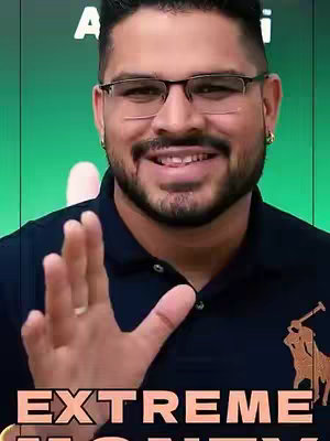 A man with glasses and a beard is smiling, and he is extending his hand towards the camera. The text "EXTREME MONEY" is overlaid at the bottom.