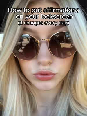 A close-up selfie of a woman wearing round sunglasses, with blonde hair framing her face. The background is blurred, with the focus on the woman's face and the text overlay.