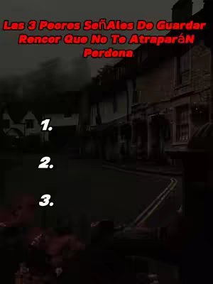 The cover image is a moody, nighttime scene of a street with buildings on the right side. Overlayed on the image is a title in red text, listing the top 3 worst signs of holding grudges, along with numbered points.