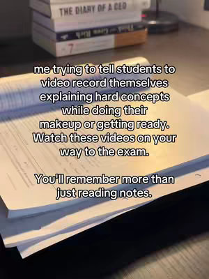 The image shows a stack of books on a desk, with a notebook open in the foreground. The text overlay suggests a study tip relating to recording yourself when explaining concepts.