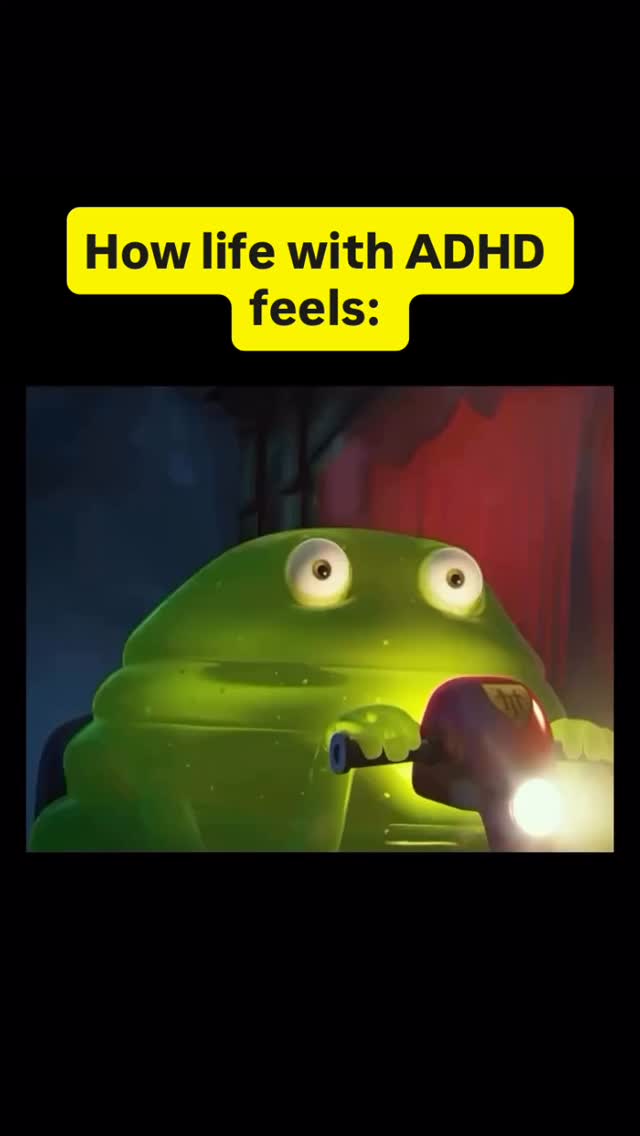 The cover image features a green animated creature, similar to a frog, with large, expressive eyes. The creature is holding the handlebars of a stylized motorcycle. In the background, there's a blend of dark blue and red hues, creating a contrast with the bright green form. A yellow banner at the top contains white text.