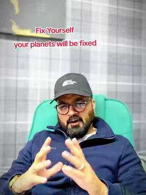 A man with a beard, glasses, and a cap sits in a chair, visible from the chest up. Overlaid on the image is the text, “Fix Yourself, your planets will be fixed”.