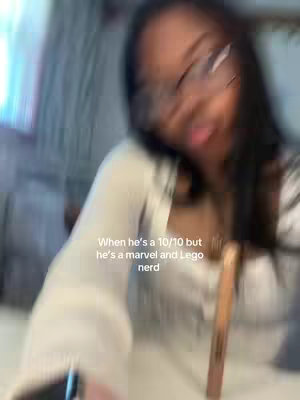 The cover image shows a blurred shot of a person, likely the creator, extending their tongue out. The person is wearing glasses and a light-colored top against an out-of-focus background. Text overlaid describes the subject's qualities, indicating it's about a dating preference.