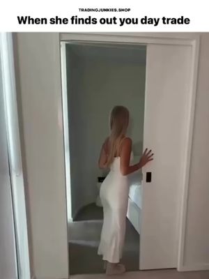 The image shows a woman walking out of a room through a white door. The woman is seen from the back and is wearing a white dress, her long blond hair flowing. The setting appears to be inside, with a glimpse of a bed visible through the doorway.