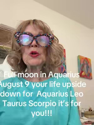 The cover image features a woman with blonde hair wearing large, decorated glasses. The text overlay reads, "Full moon in Aquarius August 9...". The woman is positioned in the center of the frame, slightly off-center, with a softly lit background.