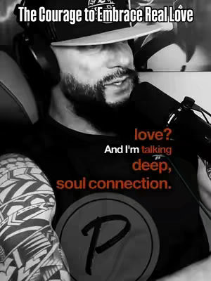 A grayscale image featuring a man with a beard, wearing a baseball cap and headphones, and speaking into a microphone. Text overlays include "The Courage to Embrace Real Love" and a question about love with the text "And I'm talking deep, soul connection."
