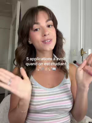 A woman with brown hair and a striped tank top is in a room. Text overlayed on the image recommends 5 applications to have as a student and the text is surrounded by star and book emojis.