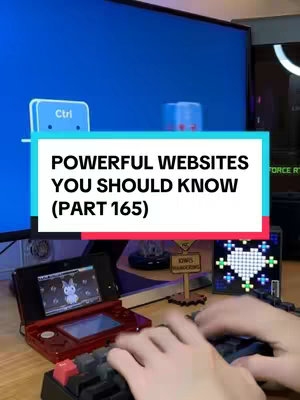 The cover image shows a person typing on a keyboard with a 3DS game console on the left, and another screen behind it. The main visual element is a rectangular text overlay that has 'POWERFUL WEBSITES YOU SHOULD KNOW (PART 165)' in prominent white text. The image is brightly lit, with a blue and red color scheme. The image is a vertical composition.