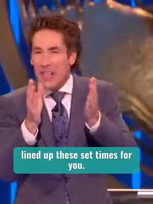 A man in a suit speaks with his palms together, with overlaid text in a blue box.