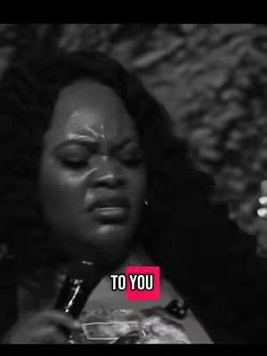 The cover image is a grayscale close-up of a woman with dark hair holding a microphone and looking downwards with an unhappy facial expression. There is a text overlay in a red rectangle that says "TO YOU".