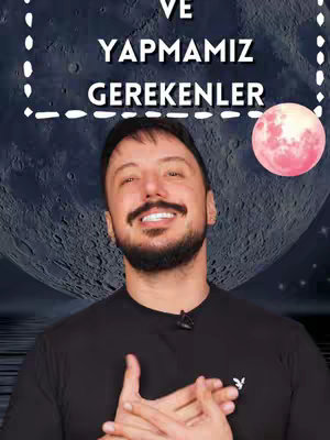 A man with a dark beard and a smile is centered in front of a space-themed background. Text is visible above his head, and a pink moon is to the right of his head. He is wearing a black shirt.
