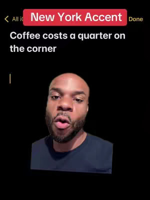 The cover image is a selfie-style shot featuring a Black man with a short beard and hair. He is set against a stark black background. Above him is a text overlay inside a red rectangle that reads "New York Accent" in white. He is positioned in the lower center, his face making a slight 'O' shape with his mouth. Above him is text in a faux notepad that reads, "Coffee costs a quarter on the corner".