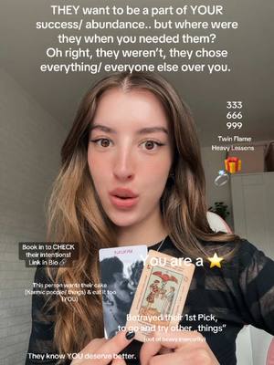 A woman with long brown hair is holding tarot cards and looking directly at the camera with a neutral expression and the tarot cards in front of her. Text overlays appear above and below her, discussing a situation of betrayal and lack of support.