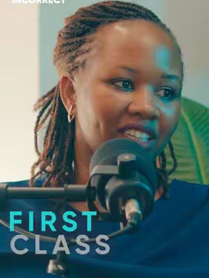 A medium shot showing a Black woman with her hair in braids, speaking into a microphone. The text 'FIRST CLASS' is layered below her, with '#FinanciallyIncorrect' in the top left corner.