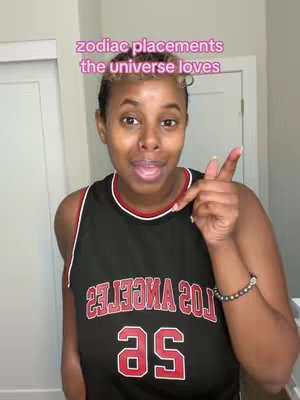 A person with light brown skin is framed from the chest up, standing in front of a white door, wearing a black sports jersey with red and white detailing. The jersey says "LOS ANGELES" across the chest and has the number "25" in red. The person has short, styled hair and is pointing towards the viewer with their right index finger while smiling. On the top of the image is a text overlay.