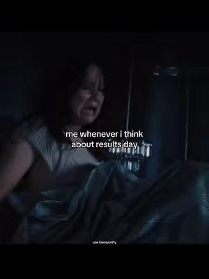 A dramatic image from a movie scene. A young woman is captured mid-scream, eyes wide with a look of terror and distress. The lighting is dim, emphasizing the shadows and highlighting her face. The text overlay reads, 'me whenever I think about results day.'